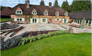 Period country house with replacement windows and a glazed garden room extension